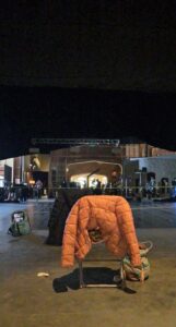 View of the Legacies set at the studio with an orange jacket in the foreground